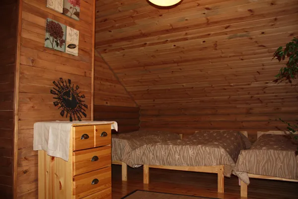 A bedroom with two single beds